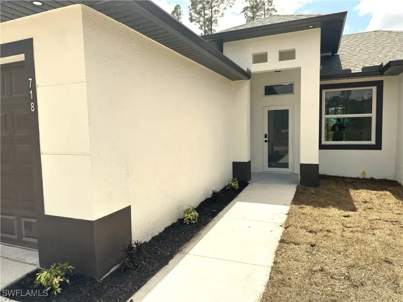 Picture of 718 Foxtail St E, Lehigh Acres FL 33974