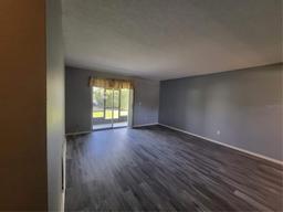 Picture of 8440 Old Post Road Unit 104, Port Richey, FL 34668